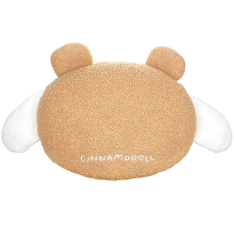 Cinnamoroll plush pillow displayed on a bed with colorful decor