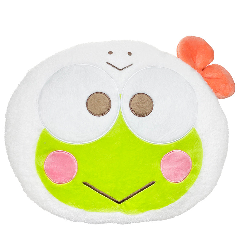 Keroppi plush toy sitting on a bed, featuring a cozy face design and textured accents.