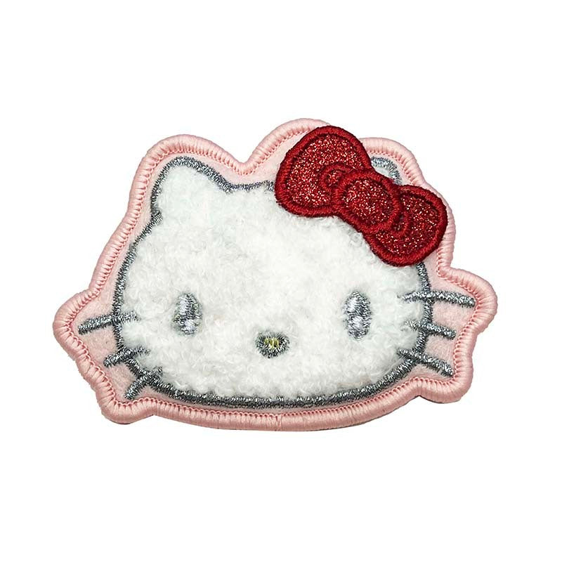 Hello Kitty 50th anniversary metallic bow brooch with shiny accents on a white background