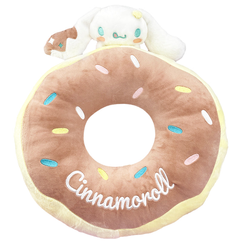 Cinnamoroll plush throw pillow on a bed, showcasing embroidered details