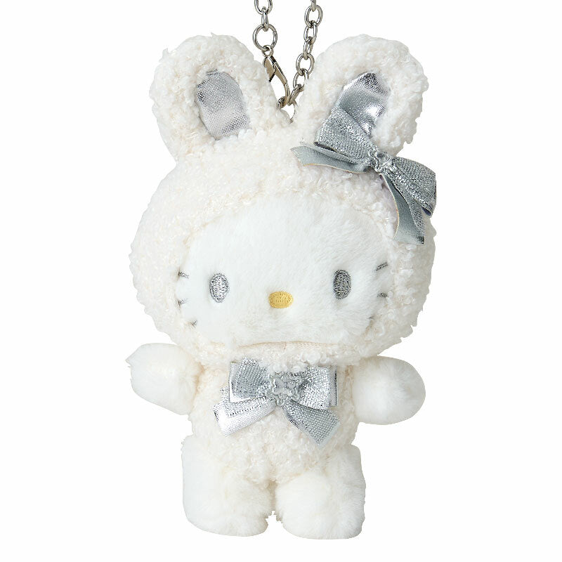 Close-up of the Hello Kitty plushs face with bunny ears and metallic eyes