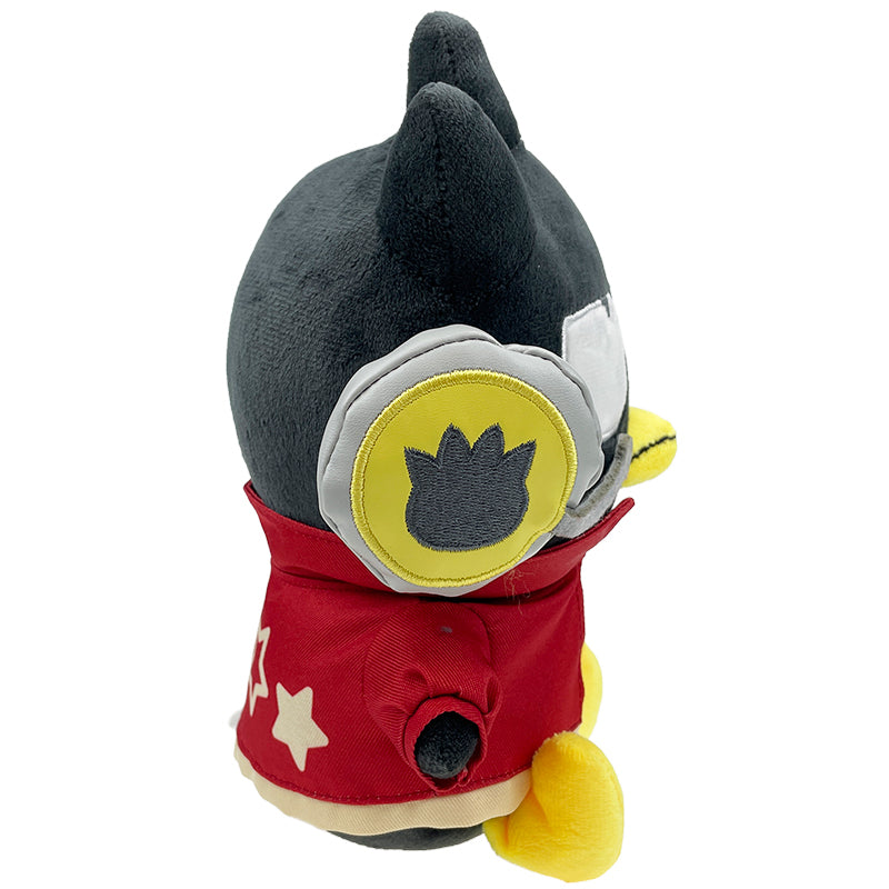 Badtz-maru gaming plush toy sitting on a gaming chair, with a gaming headset nearby