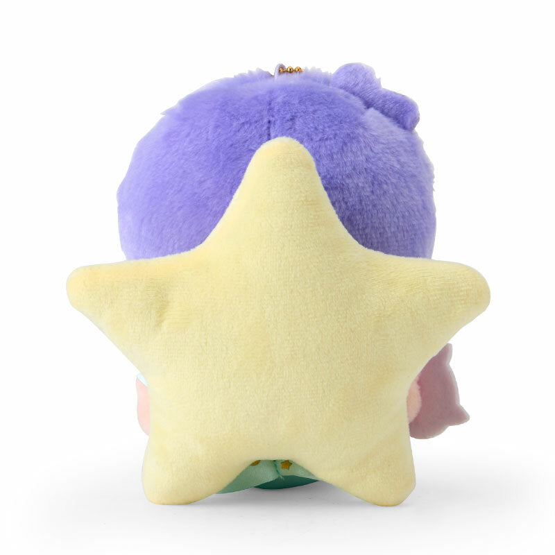 Kiki plush keychain displayed on a desk next to other cute accessories.
