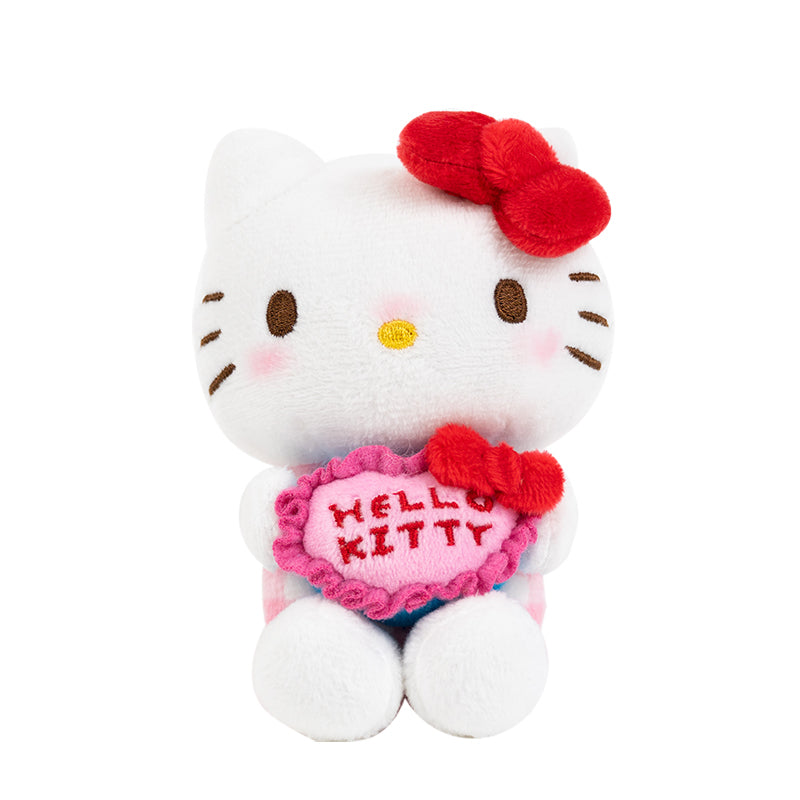 Front view of Hello Kitty keychain plush with rotary phone in pastel pink.