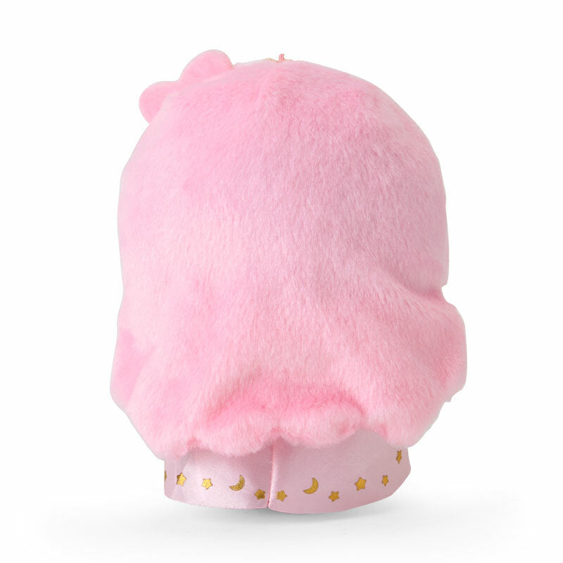 Pastel twin stars plush keychain on a desk, surrounded by other kawaii desk accessories