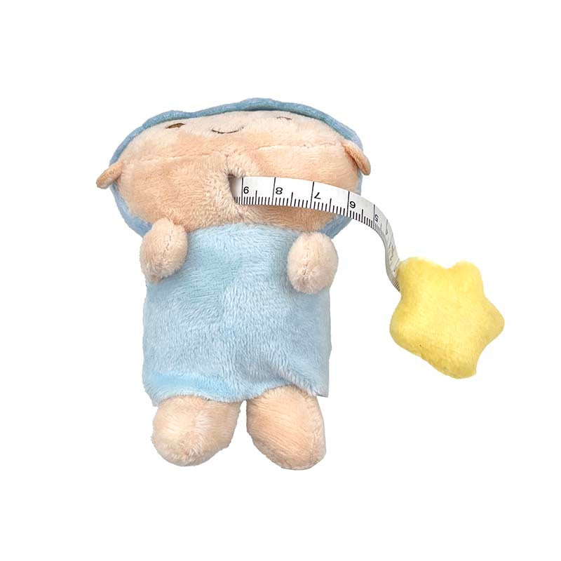 Close-up of the embroidered details on the Kiki plush measuring tape, highlighting its cute design