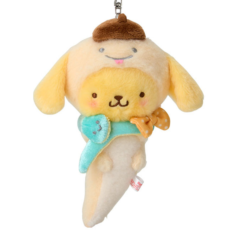 Pompompurin plush keychain attached to a stylish bag, highlighting its cute design.