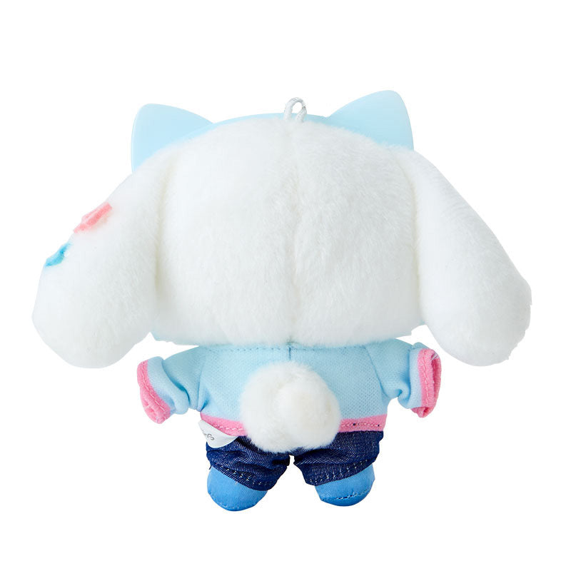 Sanrio keychain hanging from a backpack zipper in natural light