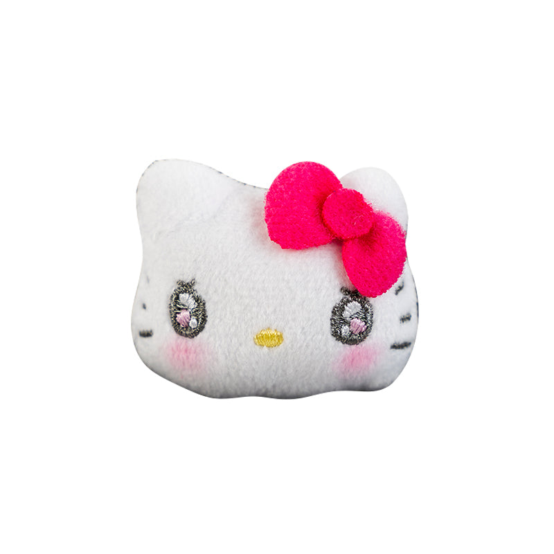Hello Kitty gold ring with Sanrio plush mascot on finger