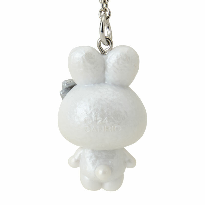 Back view showing metallic clasp and fluffy textures of the sanrio bag charm