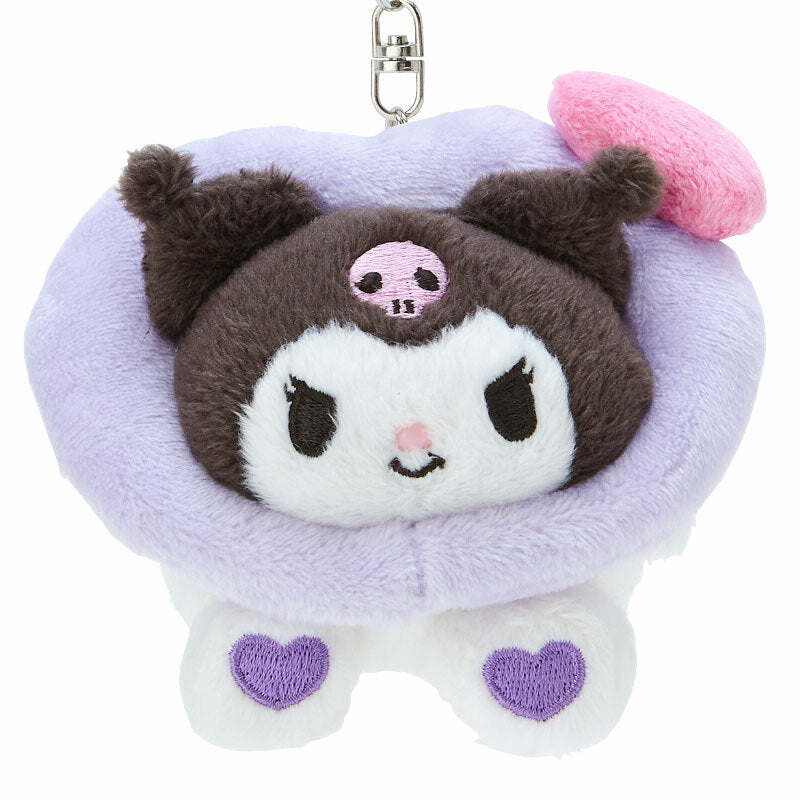 Close-up of embroidered Kuromi plush doll with pink heart-paw detailing.