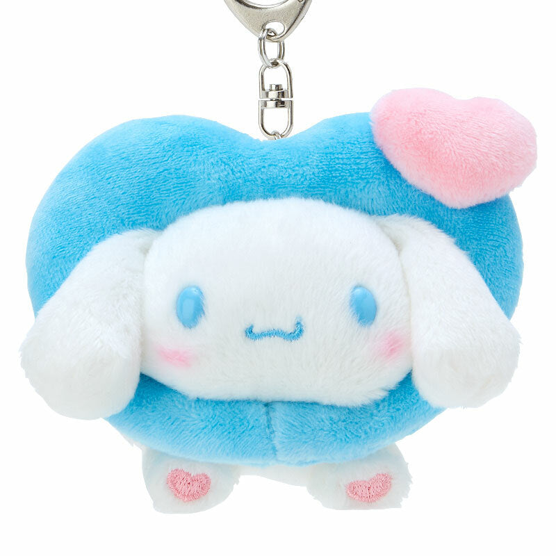Cinnamoroll keychain plush toy attached to a stylish backpack, adding cuteness.