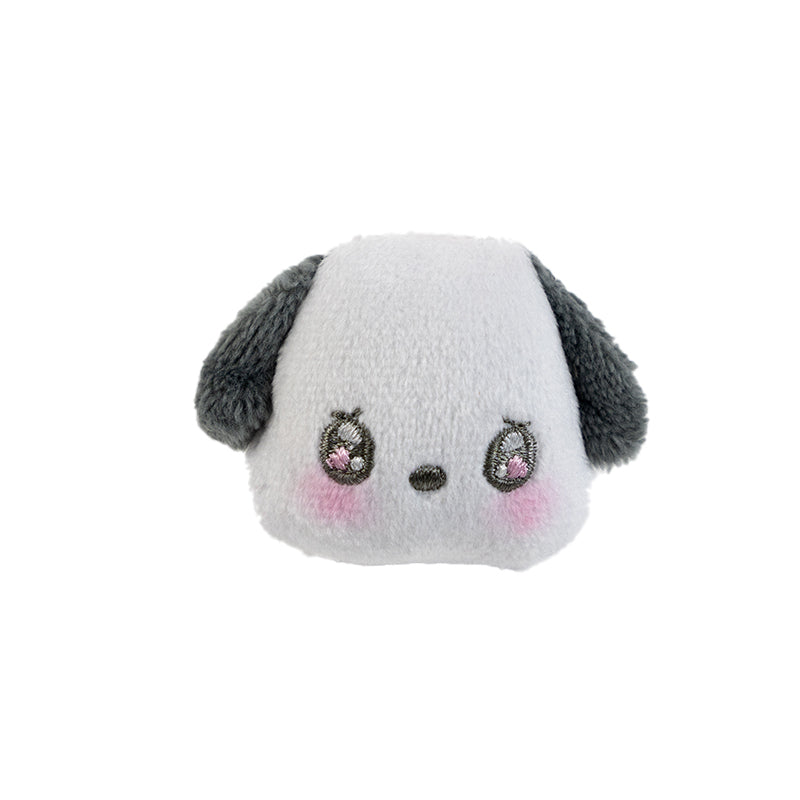 Close-up of pochacco plush mascot ring on hand showing embroidered detail