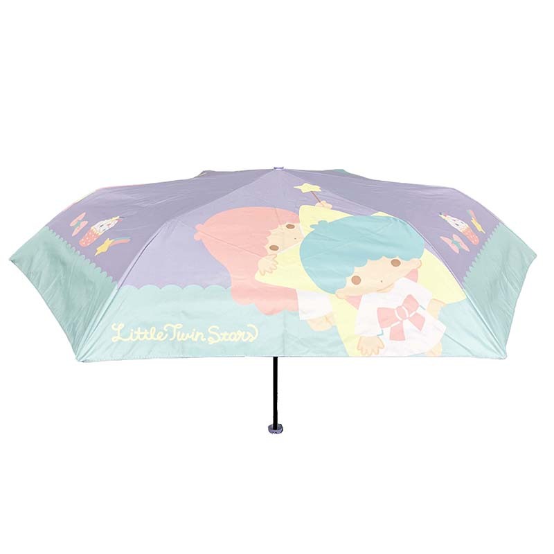 Close-up of the LittleTwinStars compact umbrella design showing candy-inspired print.
