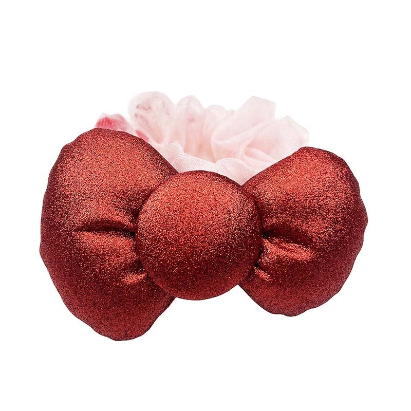 Close-up of Hello Kitty 50th anniversary hair scrunchie with metallic bow.