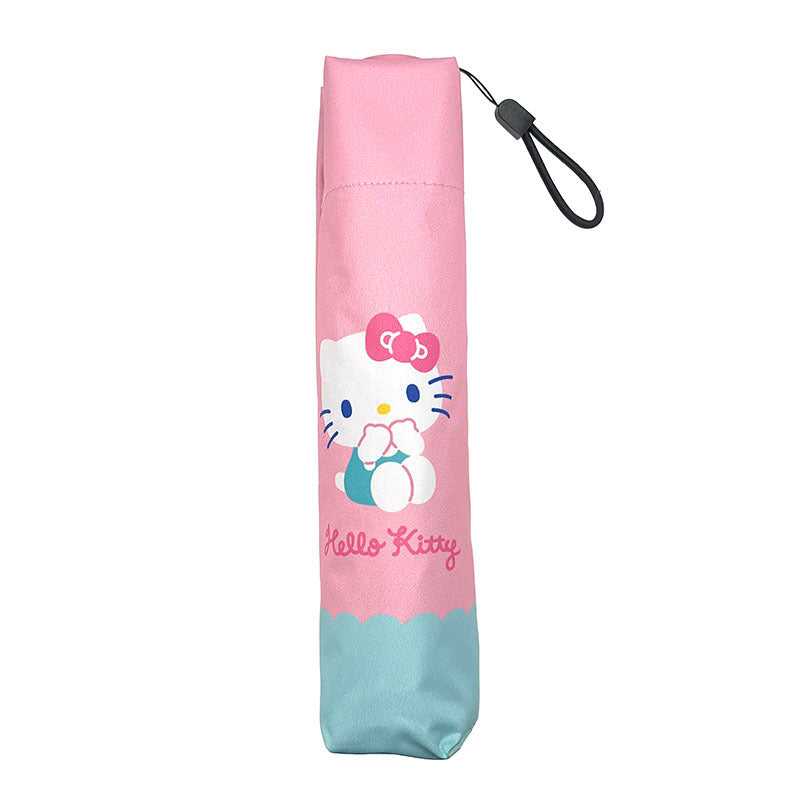 Close-up of umbrella handle and loop for hanging, designed for everyday use.
