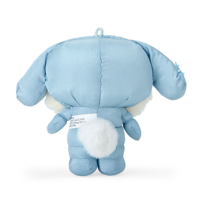 Cinnamoroll plush keychain displayed on a winter-themed background.