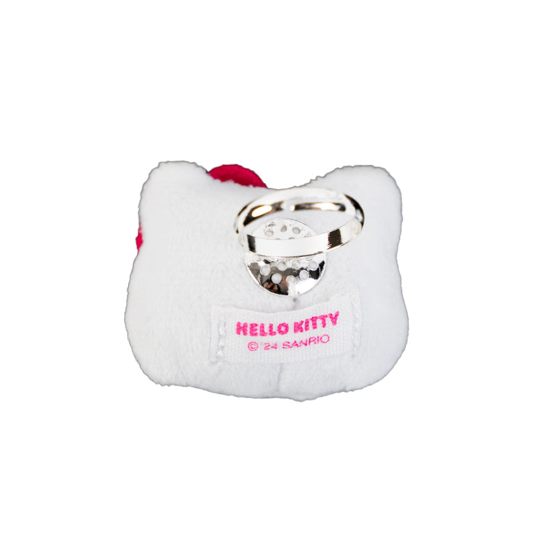 Hello Kitty plush ring displayed on a hand, highlighting its size.