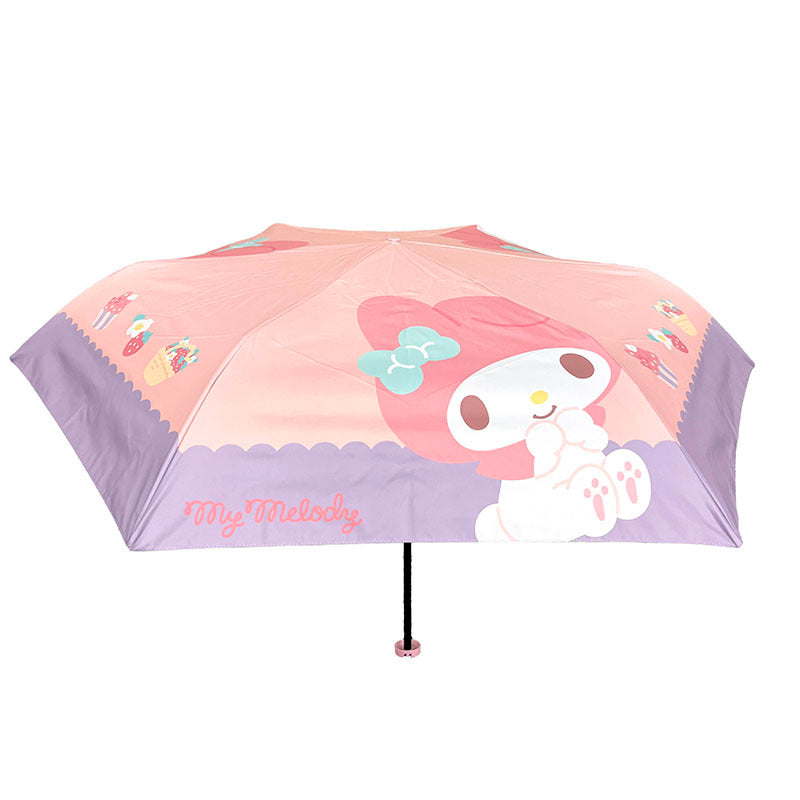 My Melody compact travel umbrella open showcasing sweet treats design.