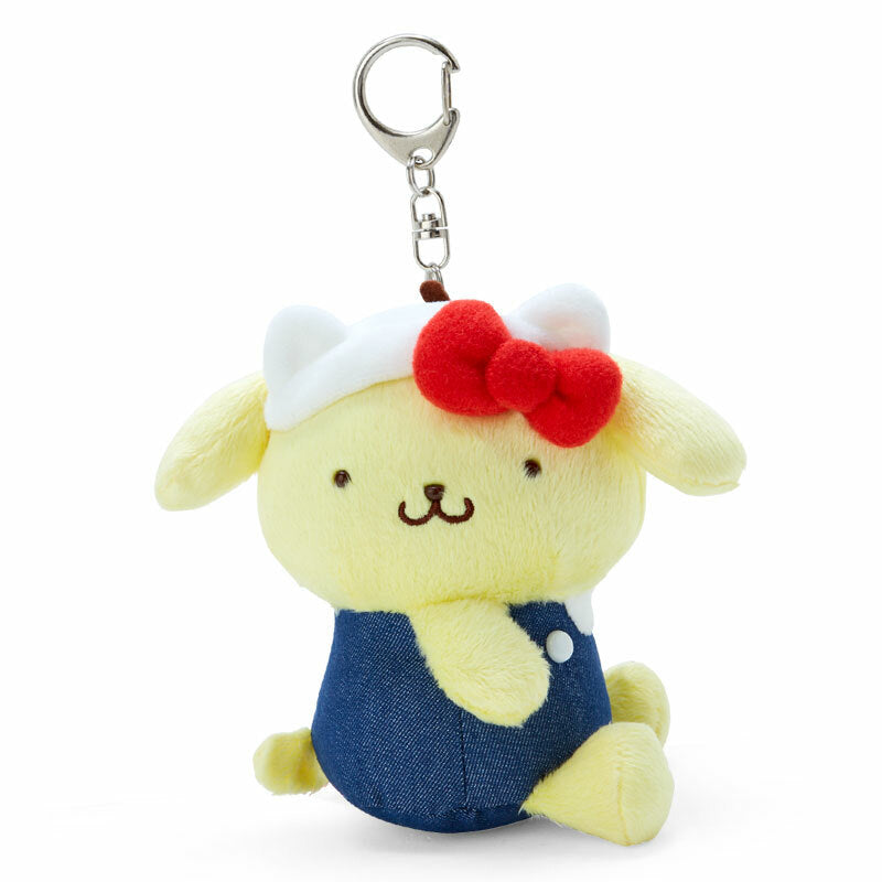 Pompompurin keychain plush attached to a stylish handbag.
