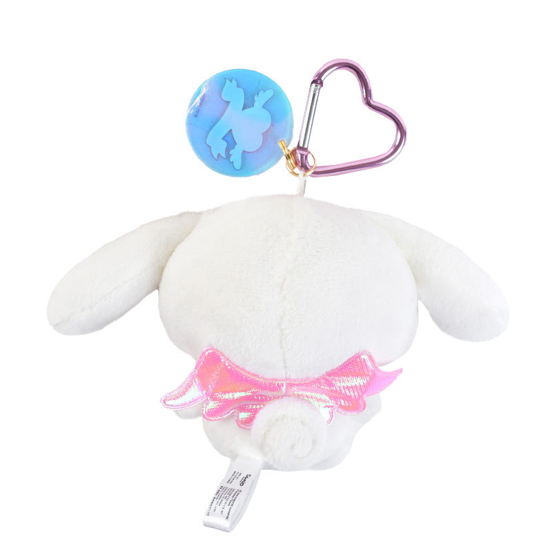 Cinnamoroll plush keychain hanging from a backpack, showcasing its vibrant colors.