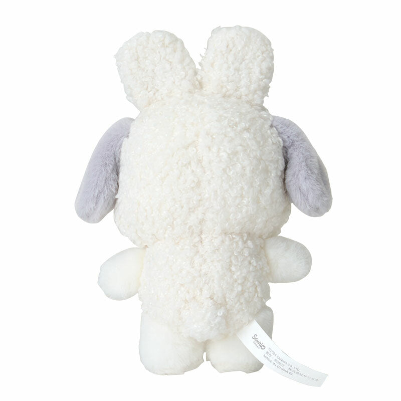 Pochacco plush attached to a stylish bag for winter fashion
