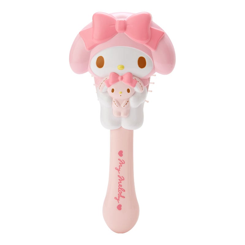 My Melody hairbrush displayed on a vanity table with beauty accessories