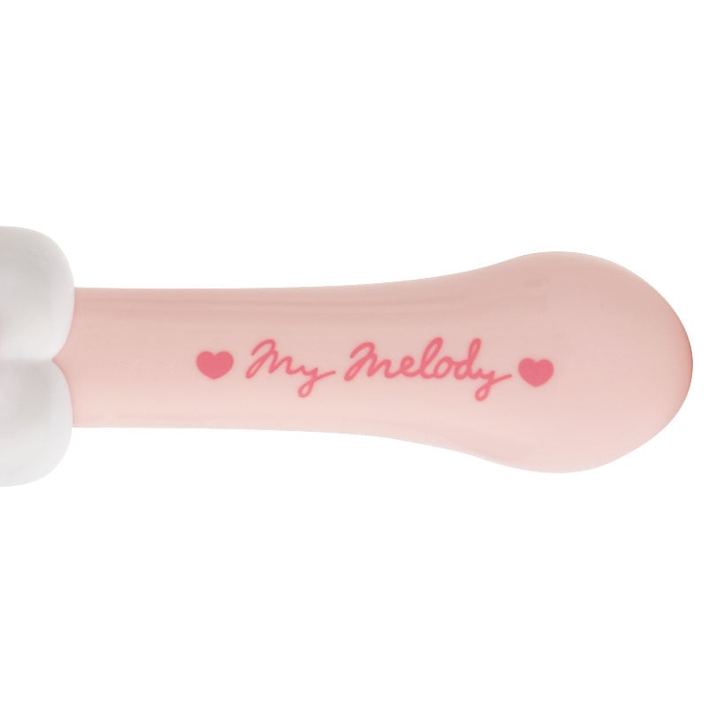 My Melody hairbrush displayed on a vanity table with beauty accessories