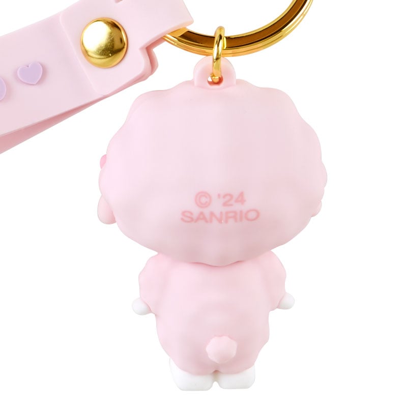 Keychain attached to a pastel backpack, showing off its cute plush design