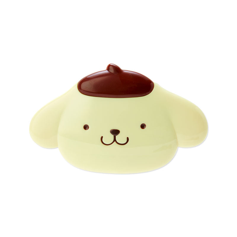 Pompompurin compact mirror and comb set displayed on a vanity.