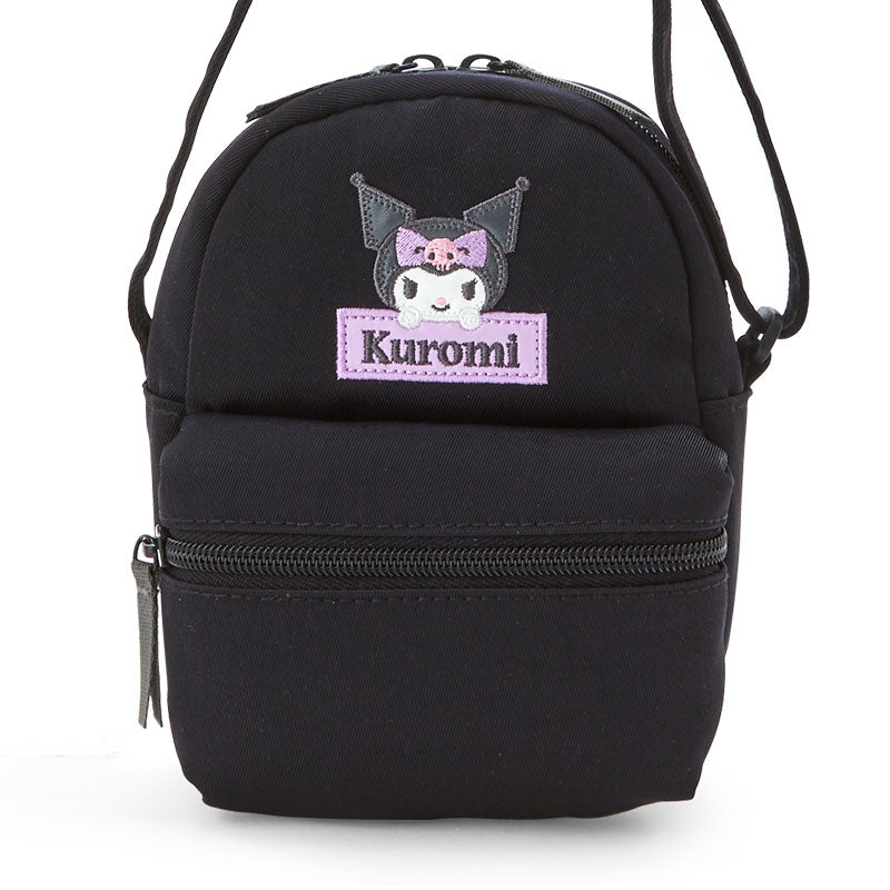 Side view of the black crossbody bag showing its compact size