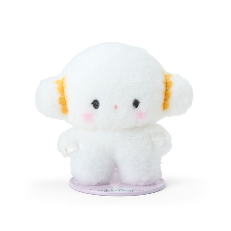 Close-up of Cogimyun standing plush with magnetic feet on a desk
