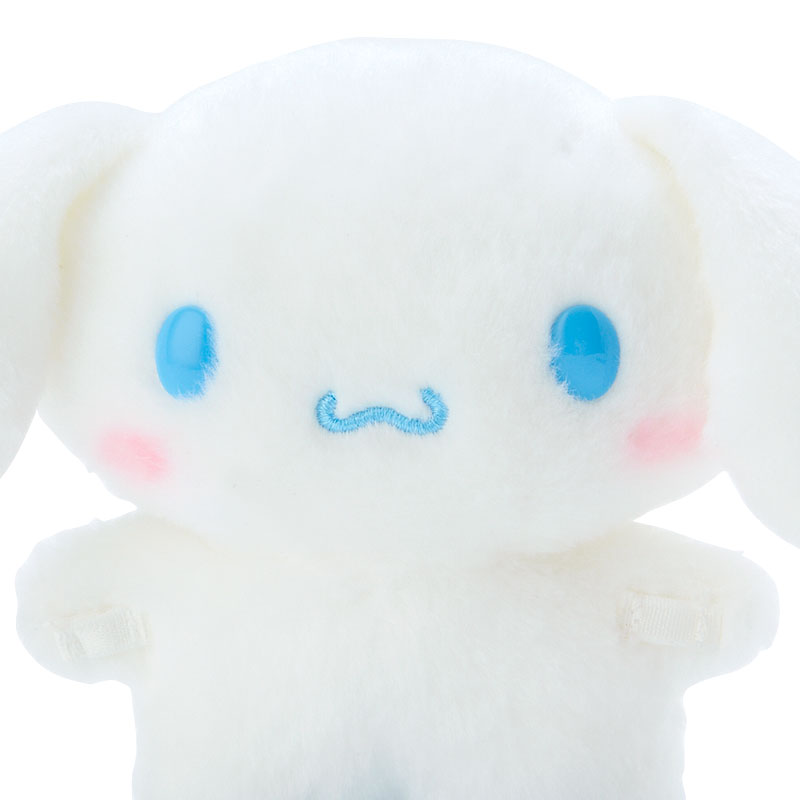 Cinnamoroll plush styled with miniature outfit in cozy NYC apartment setup