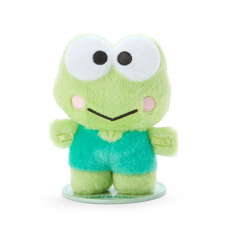 Keroppi Sanrio standing plush doll displayed on a bookshelf with other Sanrio characters