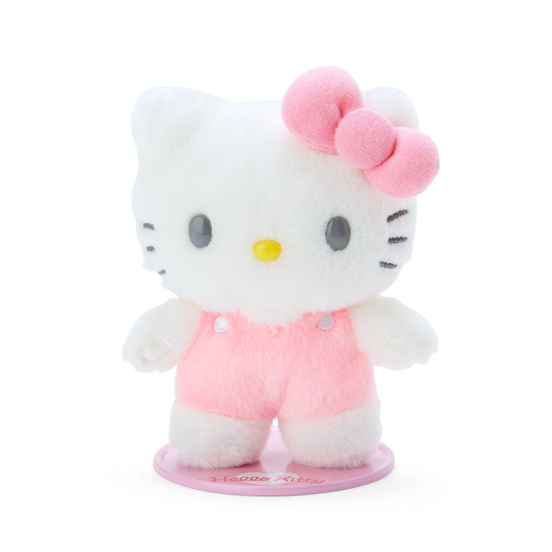 Hello Kitty plush bouquet displayed on a shelf with other Sanrio collectibles