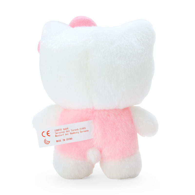 Hello Kitty plush bouquet displayed on a shelf with other Sanrio collectibles