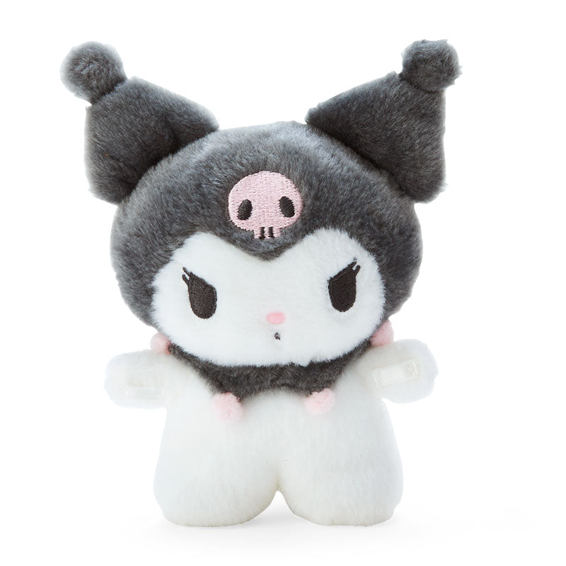 Kuromi plush doll displayed on a wooden desk with books