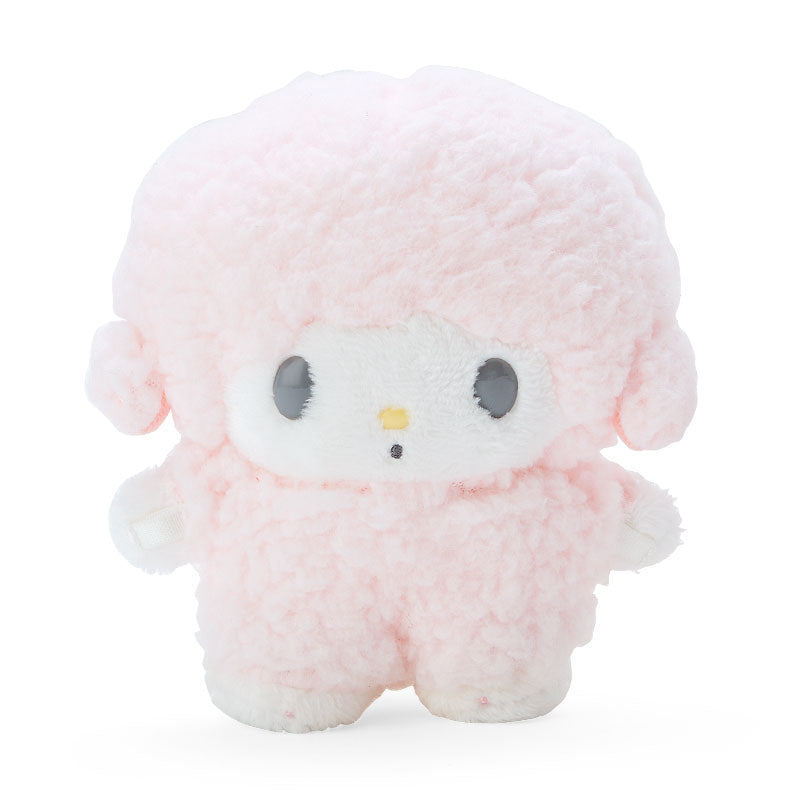 Musical Charm plush display doll standing on a desk.