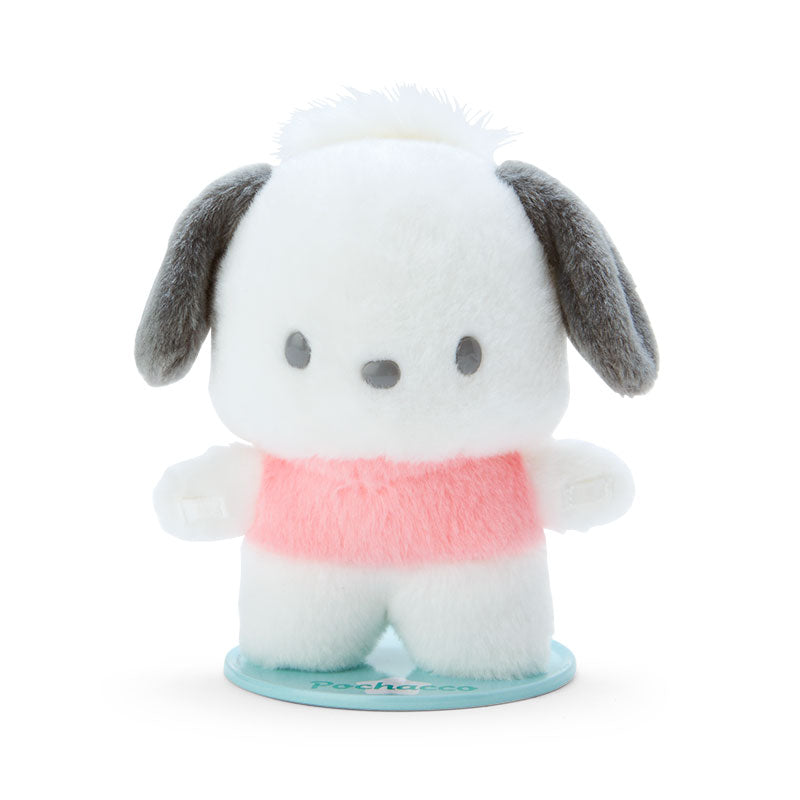Front view of the Pochacco plush toy standing upright on a desk base