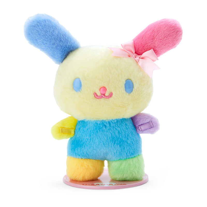 Front view of standing plush doll positioned on shelf using plush toy stand
