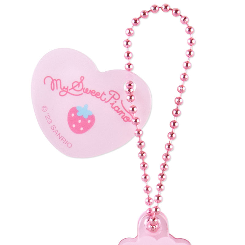 Kawaii bag charm displayed on a stylish tote bag.