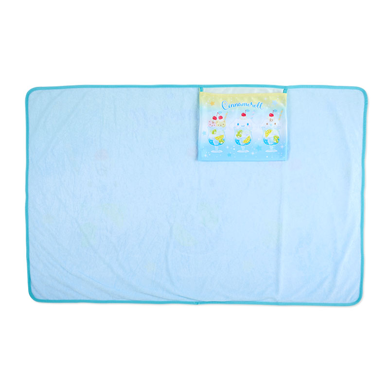 Person using weighted lap blanket while working at a desk