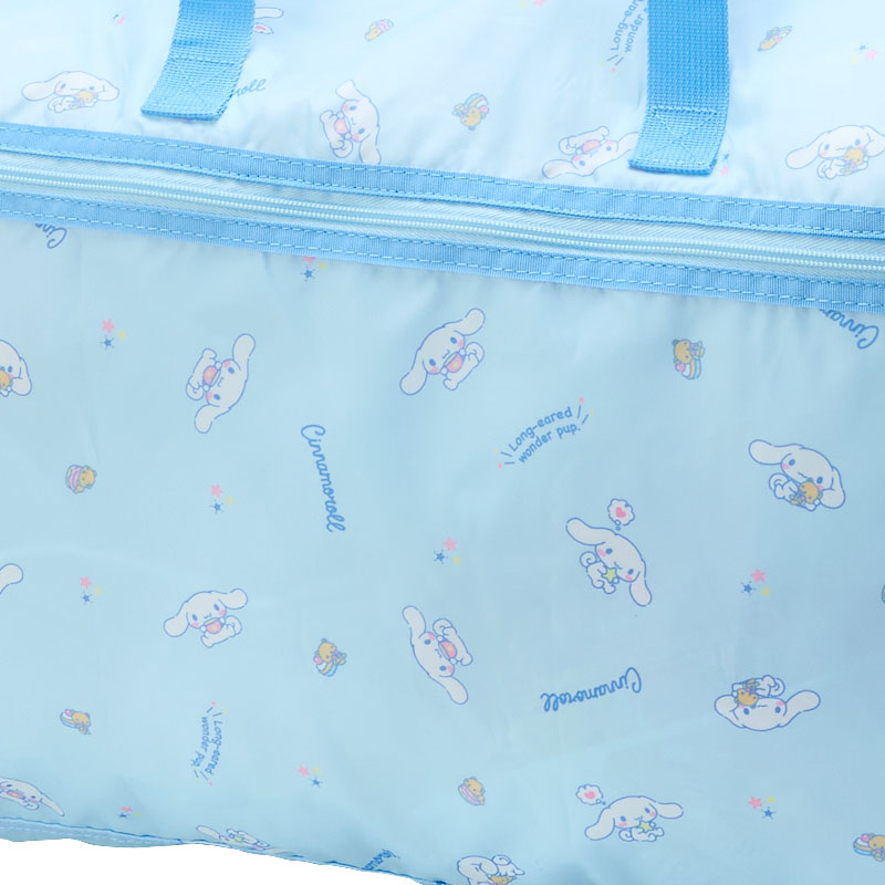 Close-up of the Cinnamoroll print on a stylish weekender bag.