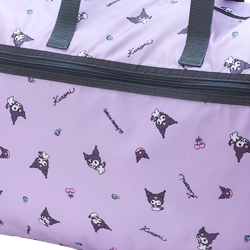 Kuromi foldable weekender bag being carried with its adjustable shoulder strap.