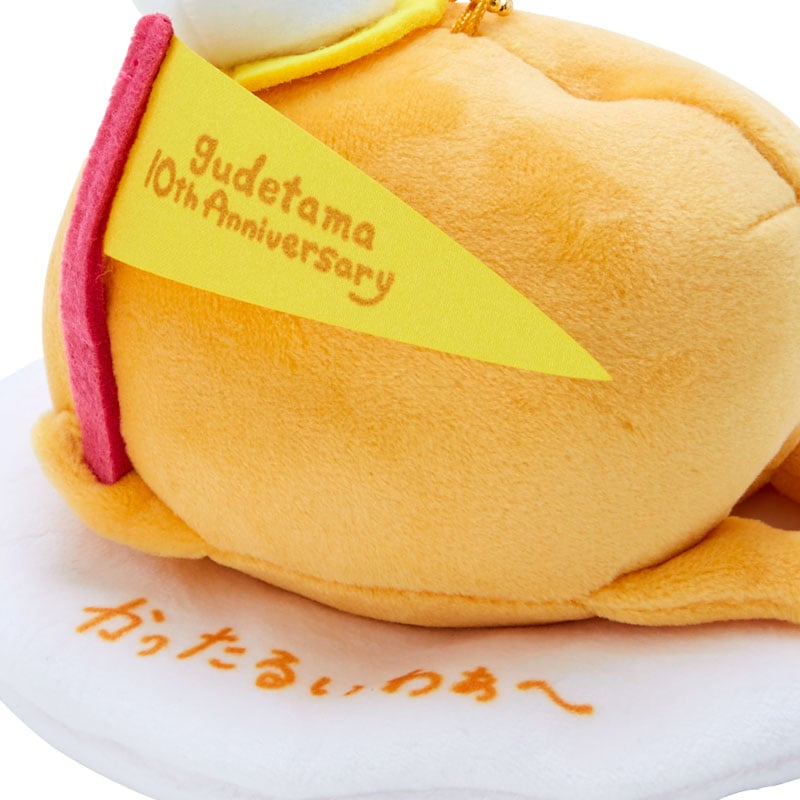 Gudetama keychain plush toy attached to a canvas tote, ideal for travel