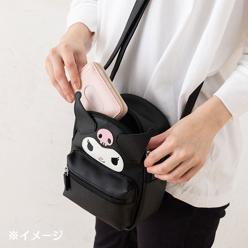 Stylish Kuromi crossbody bag worn on shoulder at a fun outdoor event