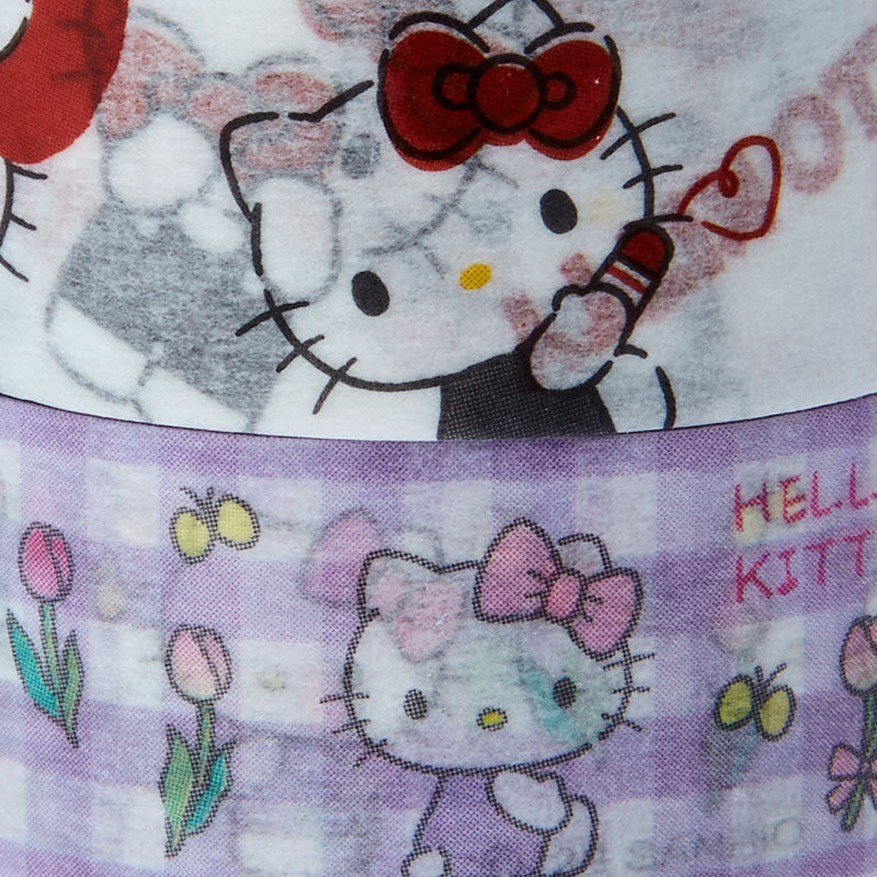 Hello Kitty washi tape set next to a Sanrio character notebook and pens