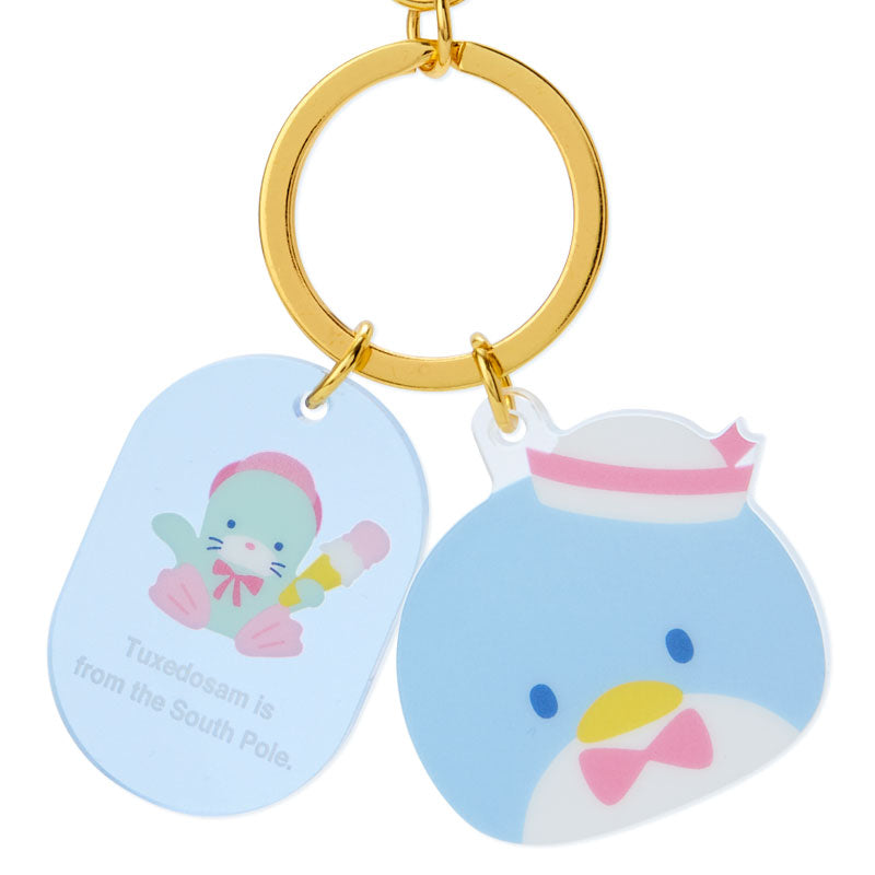 Close-up of the Tuxedosam keychain showing its acrylic material and design.