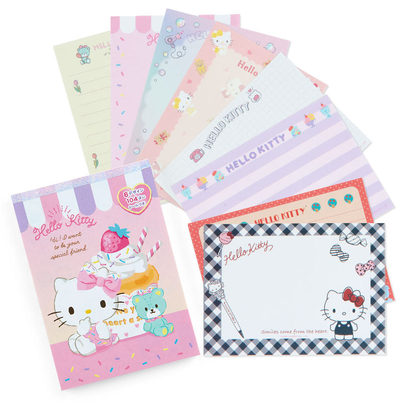 Hello Kitty memo pad displaying various designs on a desk