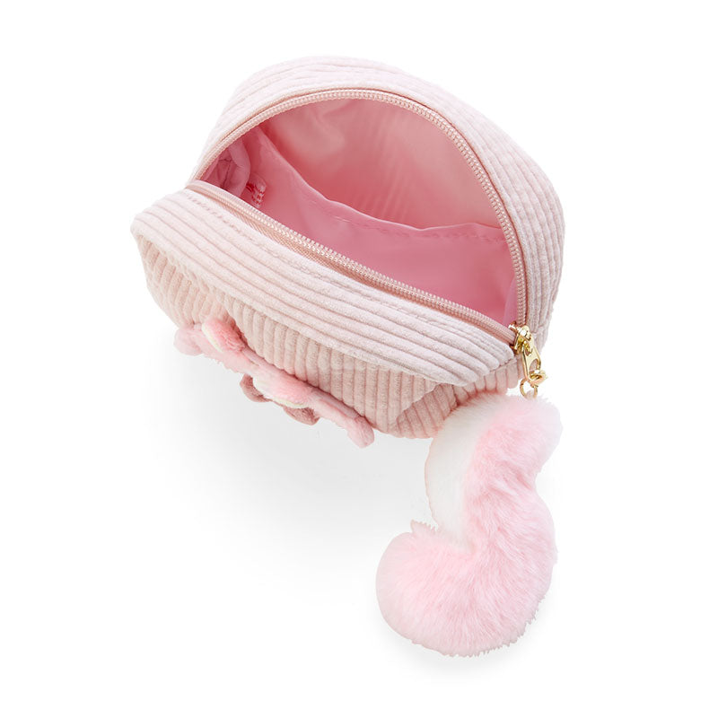 Top-down angle showing zipper pencil pouch open with makeup brushes inside